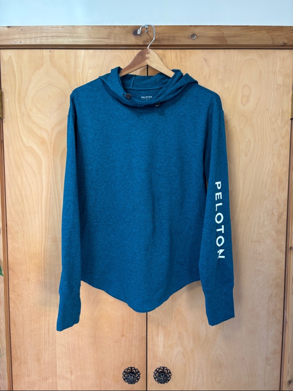 Peloton Teal Blue Hooded Pullover with Sleeve Logo